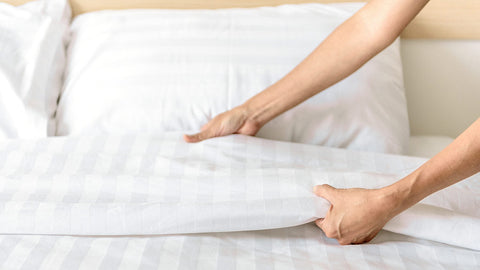 Woman Setting Bedsheet - Gsm vs Thread Count