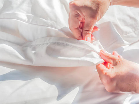 Person Checking Fabric - Best Fabric for Dust Mite Allergy